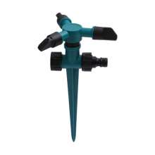 Insert a large three-head sprinkler. Automatic 360 degree rotating lawn sprinkler. Nozzle. Tandem pin nozzle