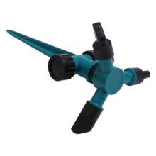 Insert a large three-head sprinkler. Automatic 360 degree rotating lawn sprinkler. Nozzle. Tandem pin nozzle