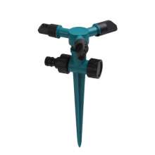 Insert a large three-head sprinkler. Automatic 360 degree rotating lawn sprinkler. Nozzle. Tandem pin nozzle