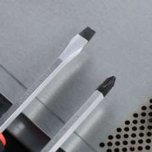 Cross with a magnetic screwdriver. Screwdriver. Hardware tools. Can be punched through the screwdriver. Screwdriver 412