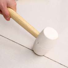Self-produced and sold white rubber hammer with oval wooden handle Non-elastic rubber hammer with wooden handle hammer to hit the floor. Rubber hammer. Floor tile hammer.