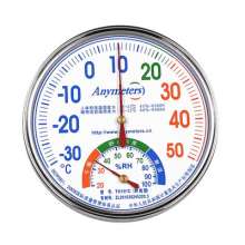 Metal case pointer thermometer and hygrometer. Temperature and humidity table for household indoor use. Hotel thermometer hygrometer