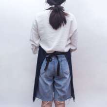 Washed oversized denim halterneck tether apron. Customized overalls apron