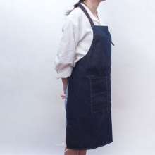 Washed oversized denim halterneck tether apron. Customized overalls apron