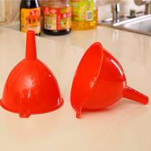Color handle funnel. Oil funnel. Household funnel