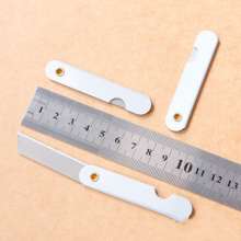 Pencil sharpening knife. Iron pencil sharpener. Folding wallpaper knife. Silver metal utility knife foil paper cutter