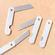 Pencil sharpening knife. Iron pencil sharpener. Folding wallpaper knife. Silver metal utility knife foil paper cutter