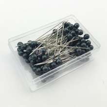 100 pearlescent needles in a colored plastic box. Paper positioning needle. Garment pin. Round pin.