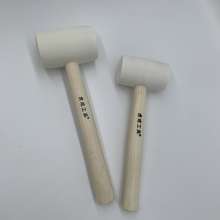 Tiger into a wooden handle white rubber hammer