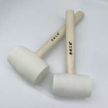 Tiger into a wooden handle white rubber hammer