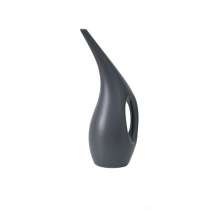 Long mouth watering pot. Domestic indoor garden watering pot for flowers and vegetables. Watering can and watering can