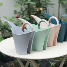 Garden watering can. Portable garden plastic watering pot for household use. Watering pot capacity 2 liters