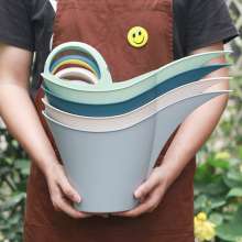 Garden watering can. Portable garden plastic watering pot for household use. Watering pot capacity 2 liters