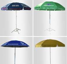 Outdoor beach umbrella on the ground. Sun umbrella custom advertising logo big umbrella sunshade big umbrella. Advertising umbrella